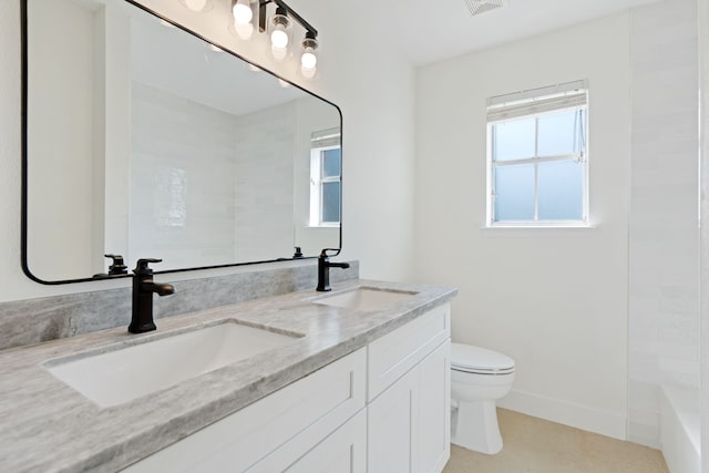 bathroom featuring vanity and toilet