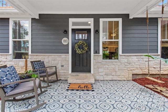 entrance to property with covered porch