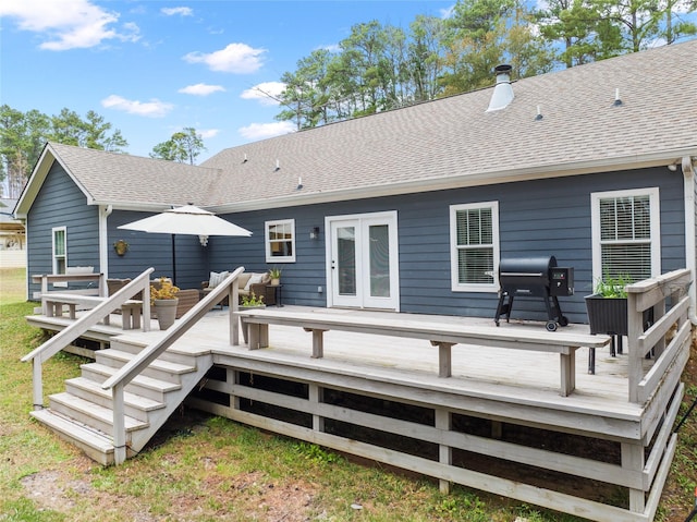 rear view of house featuring a wooden deck