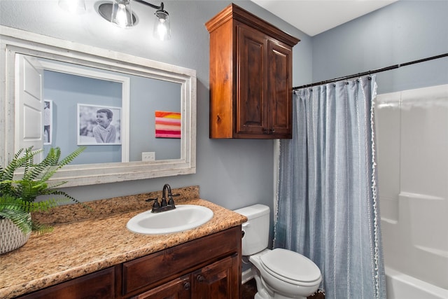 full bathroom with shower / bath combo, vanity, and toilet