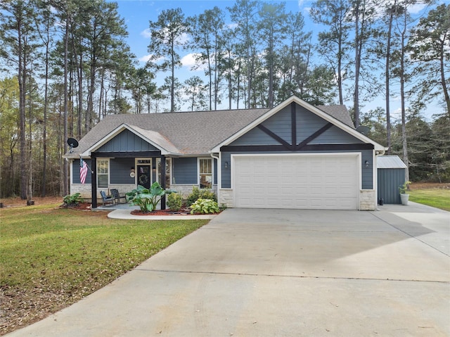 view of front of home featuring a front lawn and a garage