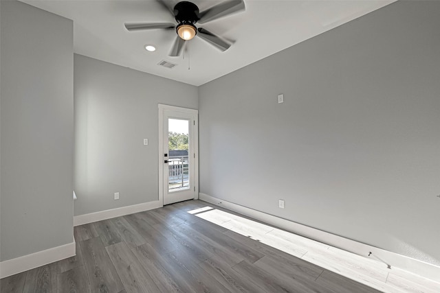 unfurnished room with ceiling fan and wood-type flooring