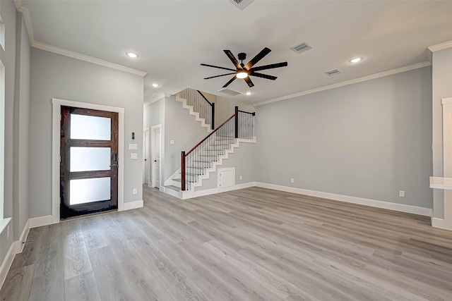 entryway with light hardwood / wood-style floors, ceiling fan, and crown molding