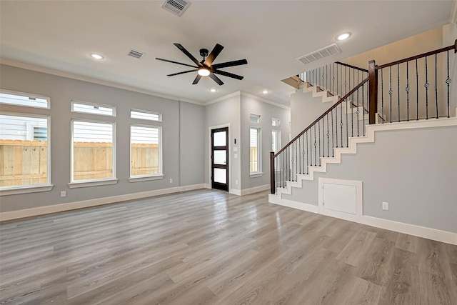 entrance foyer with ceiling fan, light hardwood / wood-style flooring, and ornamental molding