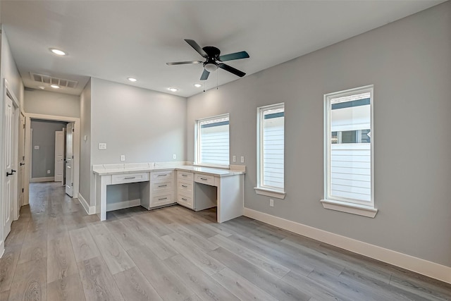 unfurnished office featuring ceiling fan and light hardwood / wood-style flooring