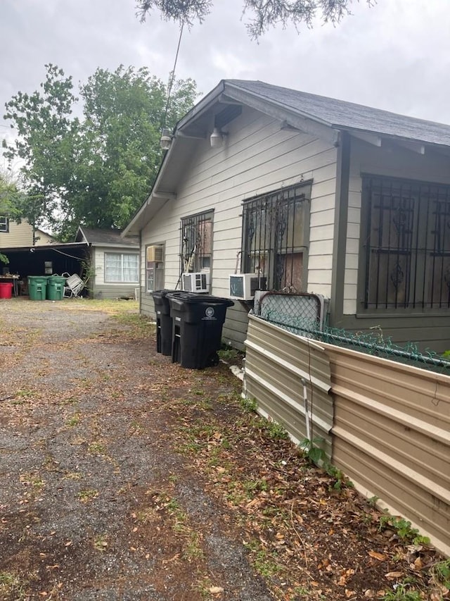 view of side of property with cooling unit