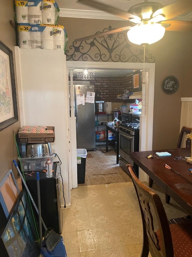 kitchen featuring ceiling fan and stainless steel appliances