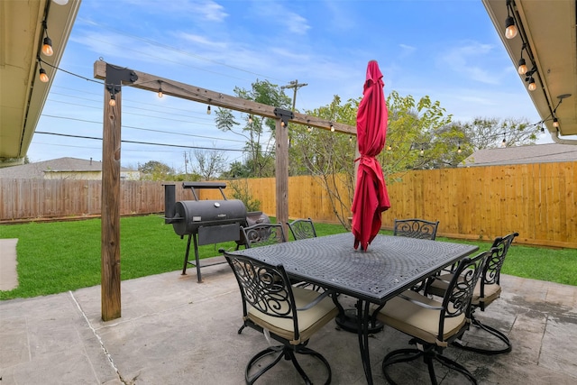 view of patio featuring a grill