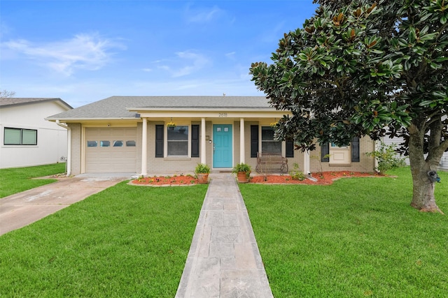 view of front of property with a porch, a garage, and a front yard