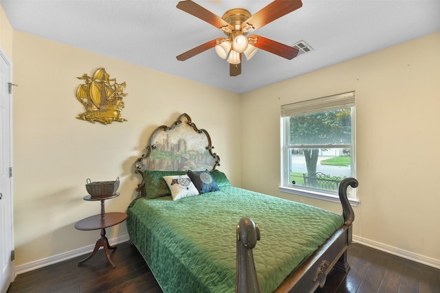 bedroom featuring ceiling fan and dark wood-type flooring