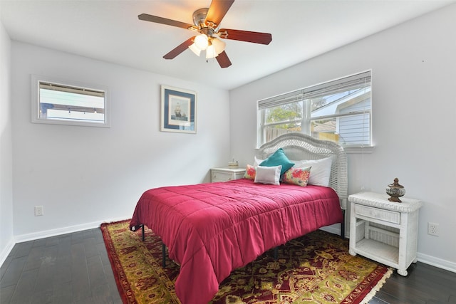 bedroom with ceiling fan and dark hardwood / wood-style floors