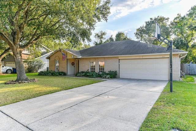 ranch-style home with a garage and a front yard