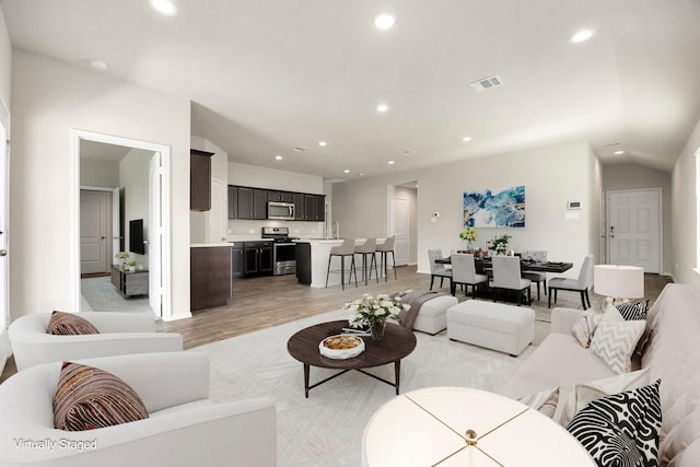 living room with light hardwood / wood-style flooring