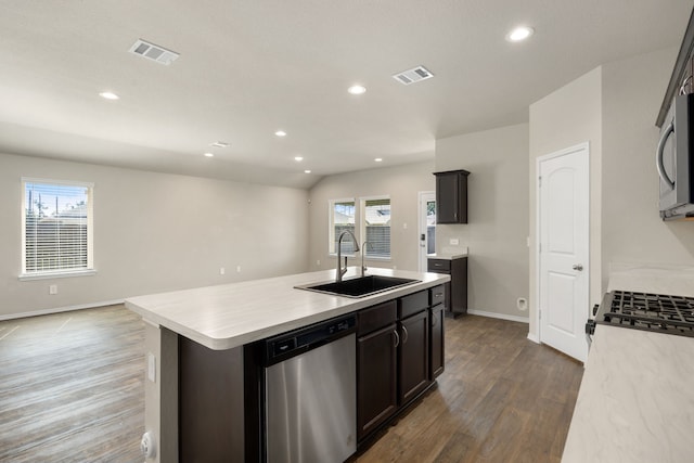 kitchen featuring dishwasher, a center island with sink, a wealth of natural light, and sink