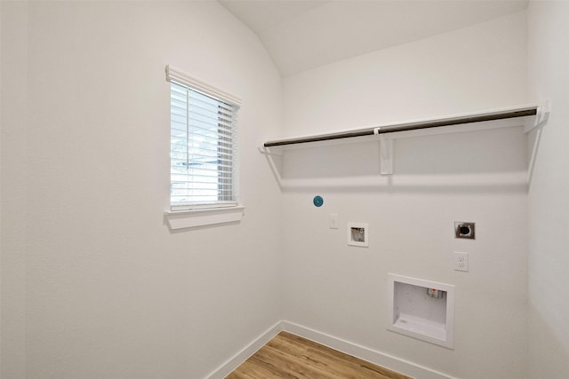 laundry area featuring hookup for a washing machine, hardwood / wood-style flooring, hookup for a gas dryer, and electric dryer hookup