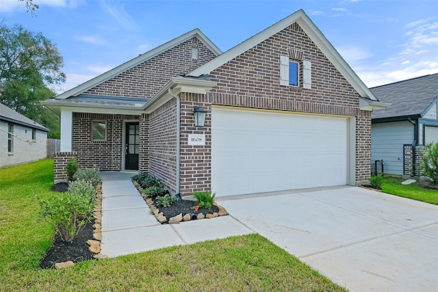 view of front of property featuring a front yard and a garage