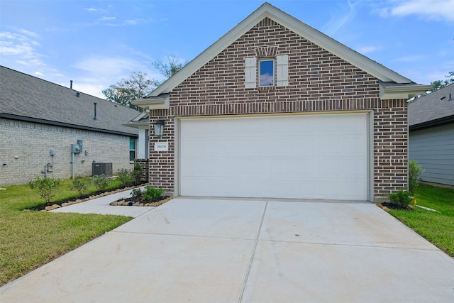 view of front of home with a garage and central AC