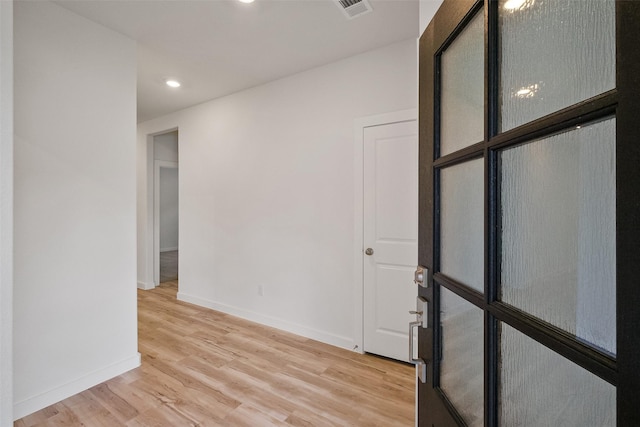 spare room featuring light hardwood / wood-style flooring