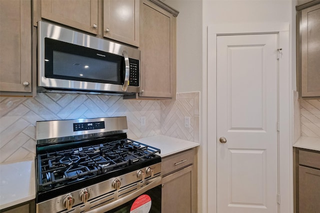 kitchen featuring backsplash and appliances with stainless steel finishes