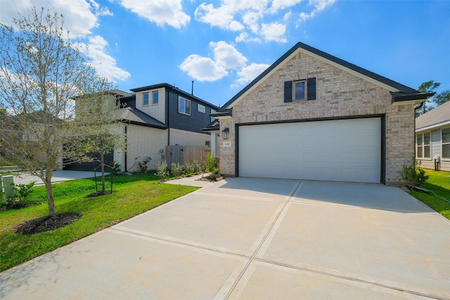 view of front facade with a garage and a front yard