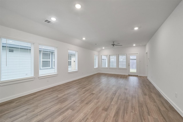 unfurnished room with ceiling fan and light wood-type flooring