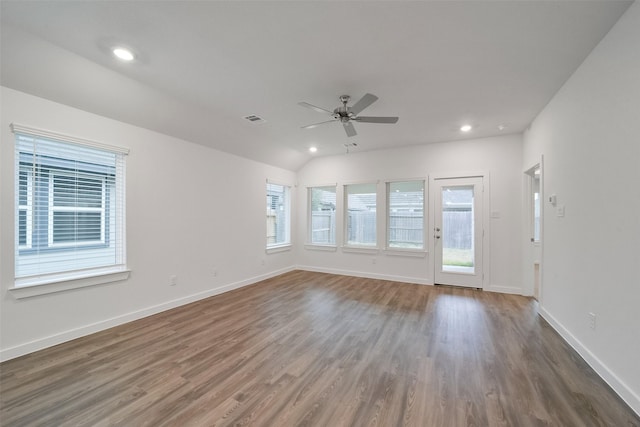 spare room with ceiling fan, plenty of natural light, dark hardwood / wood-style flooring, and lofted ceiling