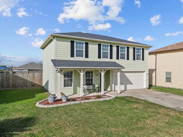 view of front property featuring a porch, a garage, and a front yard