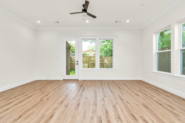 spare room with light hardwood / wood-style flooring, ceiling fan, and ornamental molding