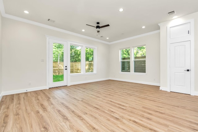 unfurnished room featuring plenty of natural light, crown molding, and ceiling fan