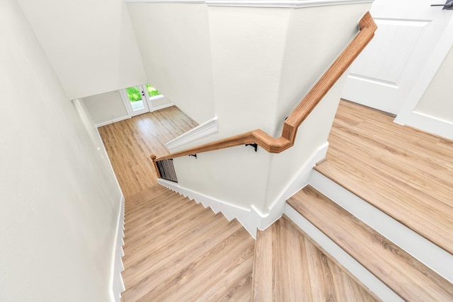 stairs with hardwood / wood-style floors