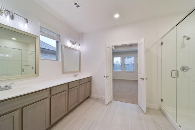 bathroom with vanity and an enclosed shower