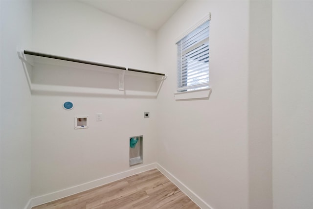 washroom featuring gas dryer hookup, electric dryer hookup, washer hookup, and light hardwood / wood-style floors