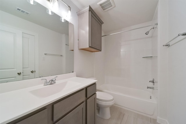 full bathroom featuring vanity, shower / tub combination, and toilet