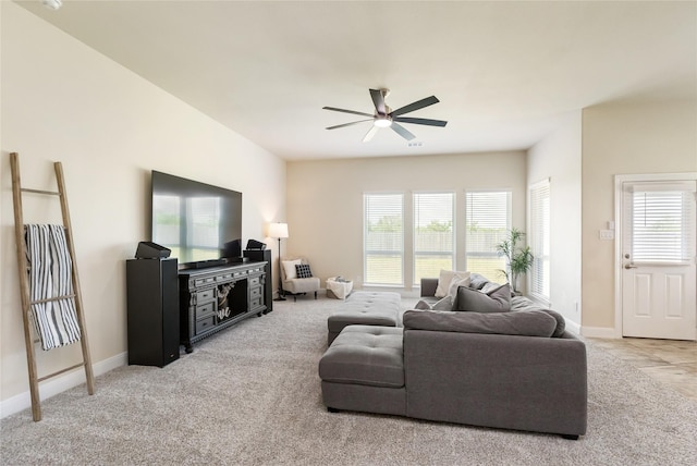 living room featuring ceiling fan and light carpet