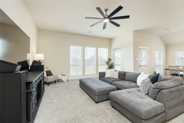 carpeted living room with ceiling fan