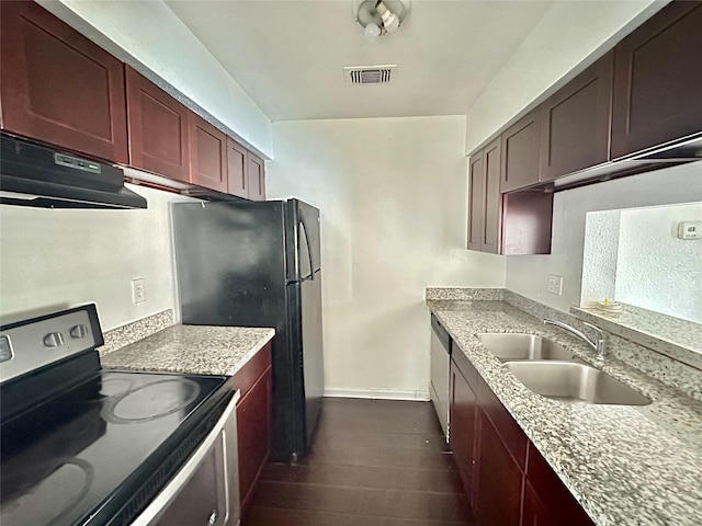 kitchen featuring dark wood-type flooring, black appliances, ventilation hood, sink, and light stone counters