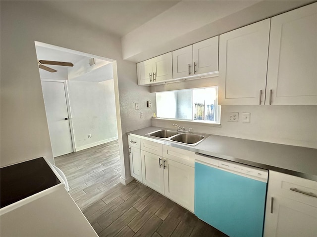 kitchen with stove, white cabinets, sink, ceiling fan, and dishwashing machine