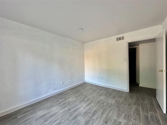 empty room with wood-type flooring