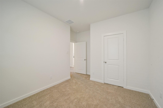 unfurnished bedroom with light carpet