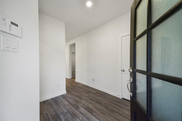 spare room with dark wood-type flooring