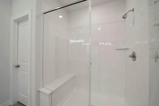 bathroom with a tile shower