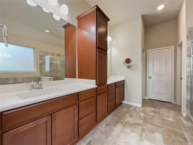 bathroom featuring vanity and a shower with door