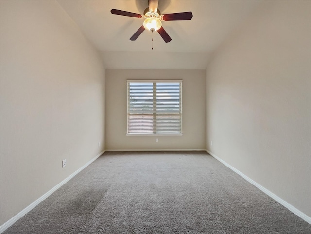 unfurnished room featuring ceiling fan, carpet, and vaulted ceiling