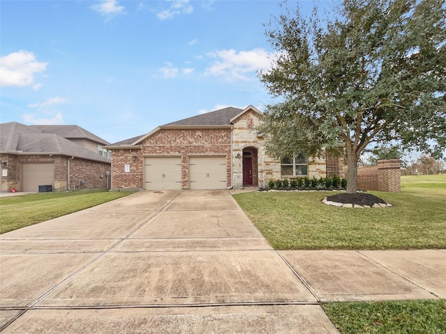 view of front of house featuring a front yard and a garage