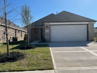 ranch-style house with a garage and a front lawn