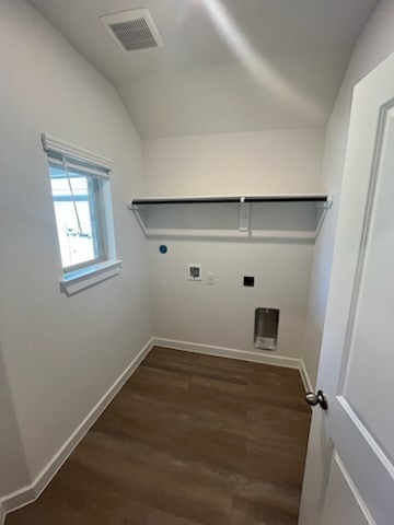 washroom with hookup for an electric dryer, washer hookup, and dark wood-type flooring