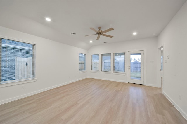 unfurnished room featuring lofted ceiling, light hardwood / wood-style floors, and ceiling fan