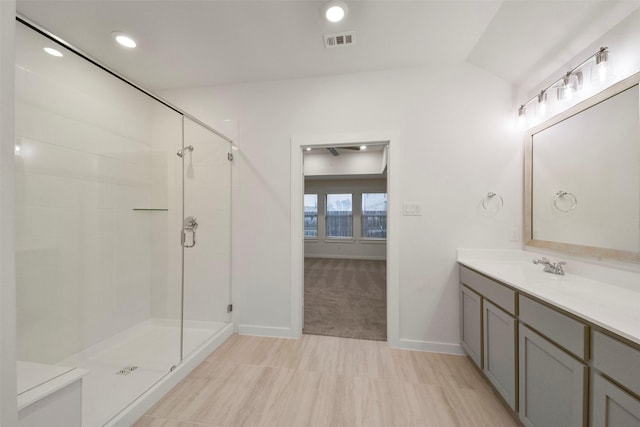 bathroom with vanity and an enclosed shower