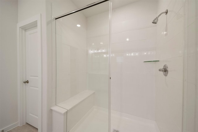 bathroom with a tile shower