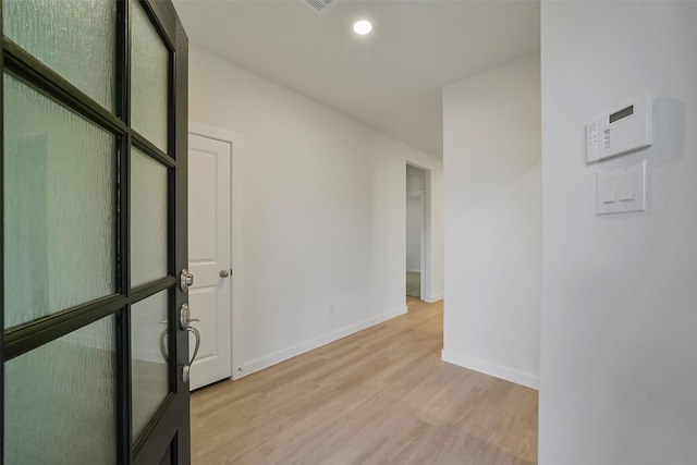 hall featuring light hardwood / wood-style flooring